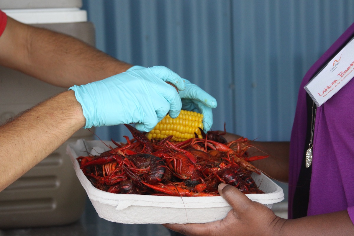 Arc of Acadiana employees enjoying the benefits of a staff crawfish boil
